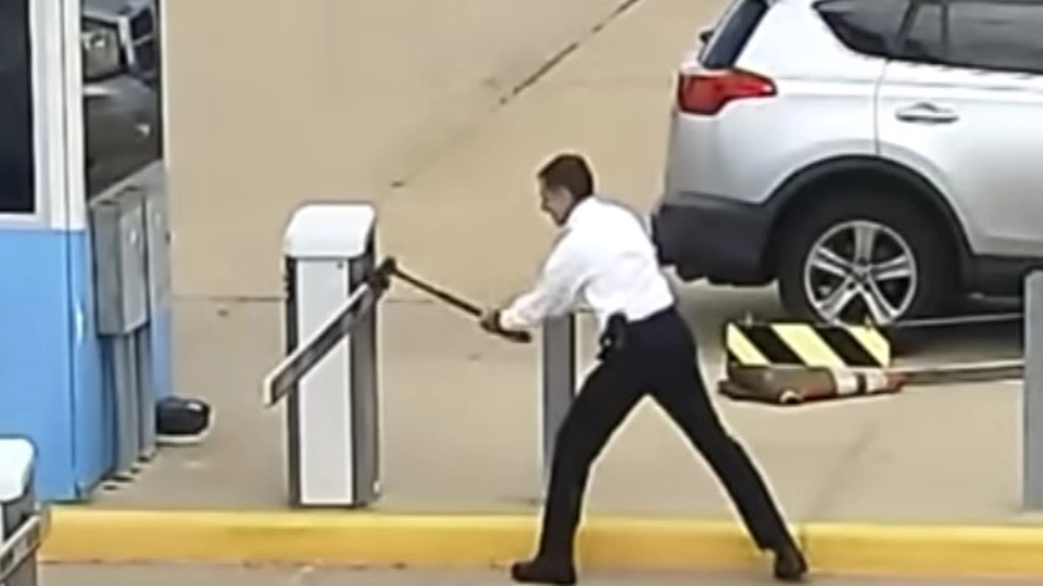 Man goes berserk on parking barrier with axe: Tired of waiting
