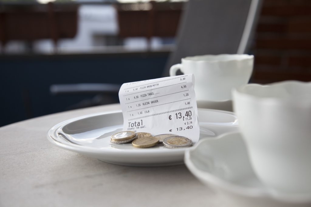 Why Tipping Died in Europe — But Became Essential in America