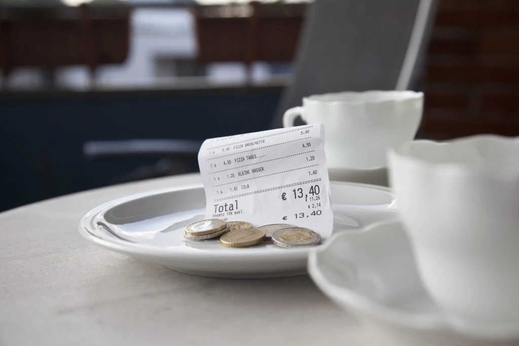 Why Tipping Died in Europe — But Became Essential in America