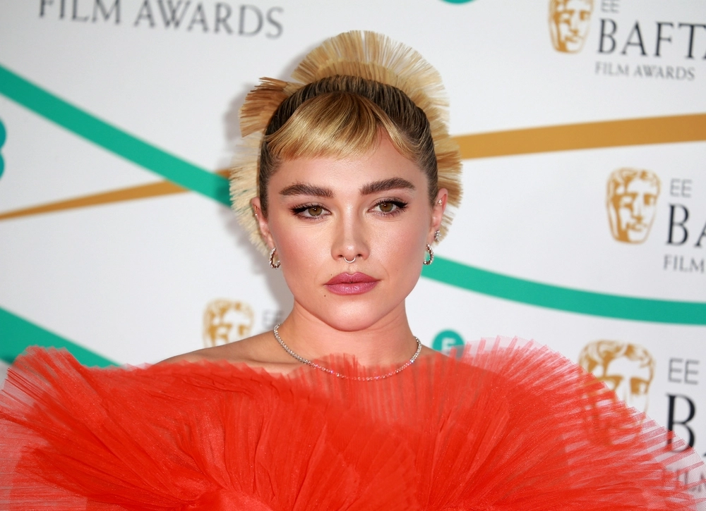 Florence Pugh gets hit in the head as fans throw things on stage at Dune event