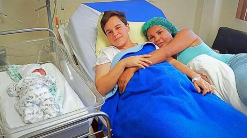 They appear as ordinary new parents, but try take a closer look