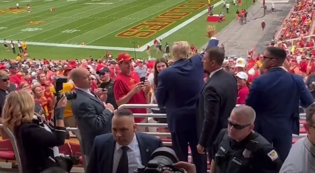 Trump stands up and waves at Iowa football game: Now look at the reactions