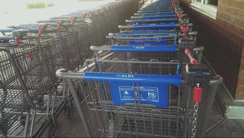 Mother notices family in front of her arranging groceries strangely on the conveyor belt, then realizes why