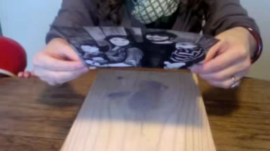 Woman puts family photo on painted wooden plank: See what happens when she returns the next day