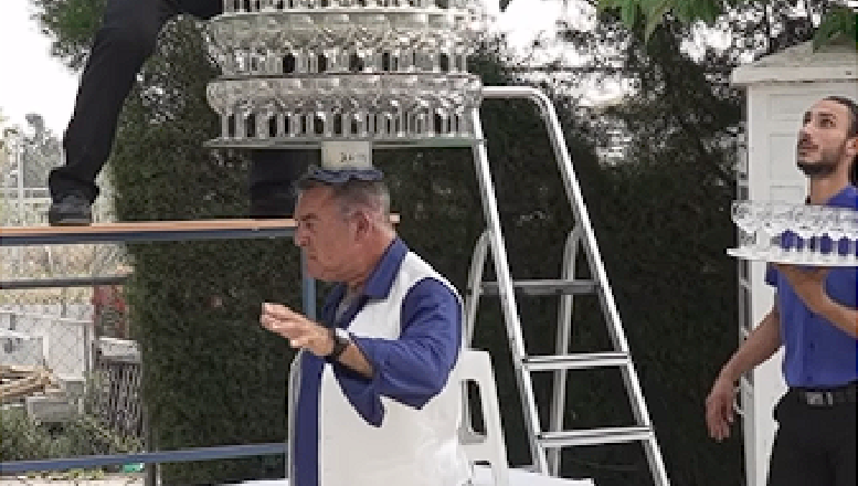 Man attempts to break world record by balancing 319 wine glasses on his head: Then the inevitable happens