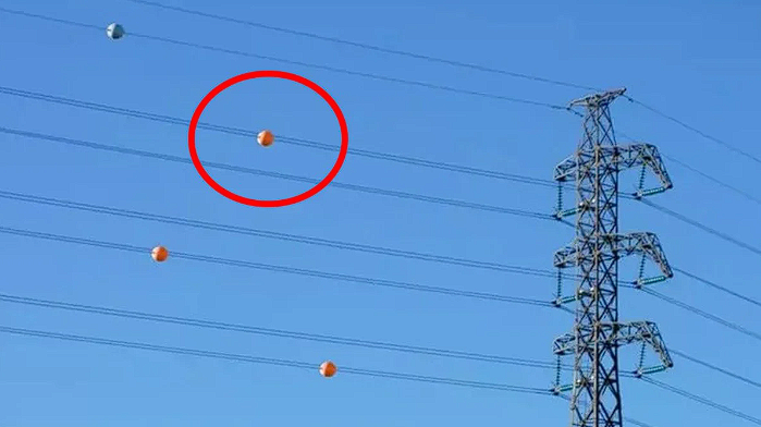 The Purpose of Those Colorful Spheres on Power Lines