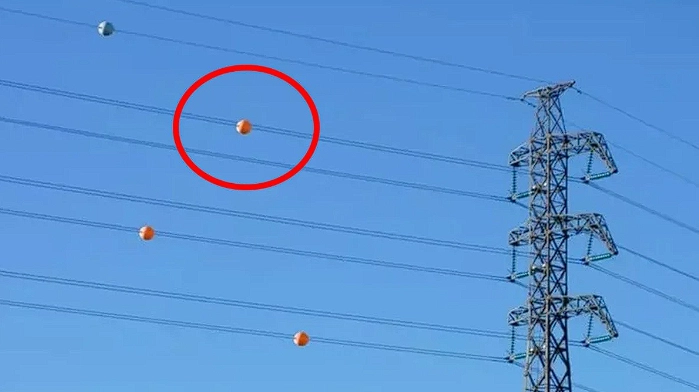 The Purpose of Those Colorful Spheres on Power Lines