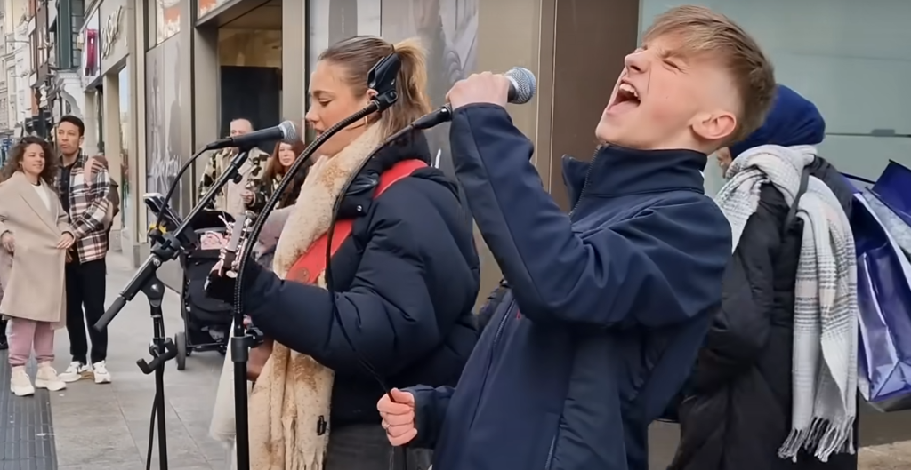 14-Year-Old Rhys’ Incredible Cover of Elvis’ ‘Heartbreak Hotel’ Stops ‘Traffic’ on Busy Dublin Street