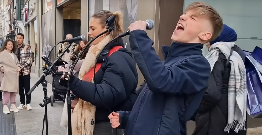 14-Year-Old Rhys’ Incredible Cover of Elvis’ ‘Heartbreak Hotel’ Stops ‘Traffic’ on Busy Dublin Street